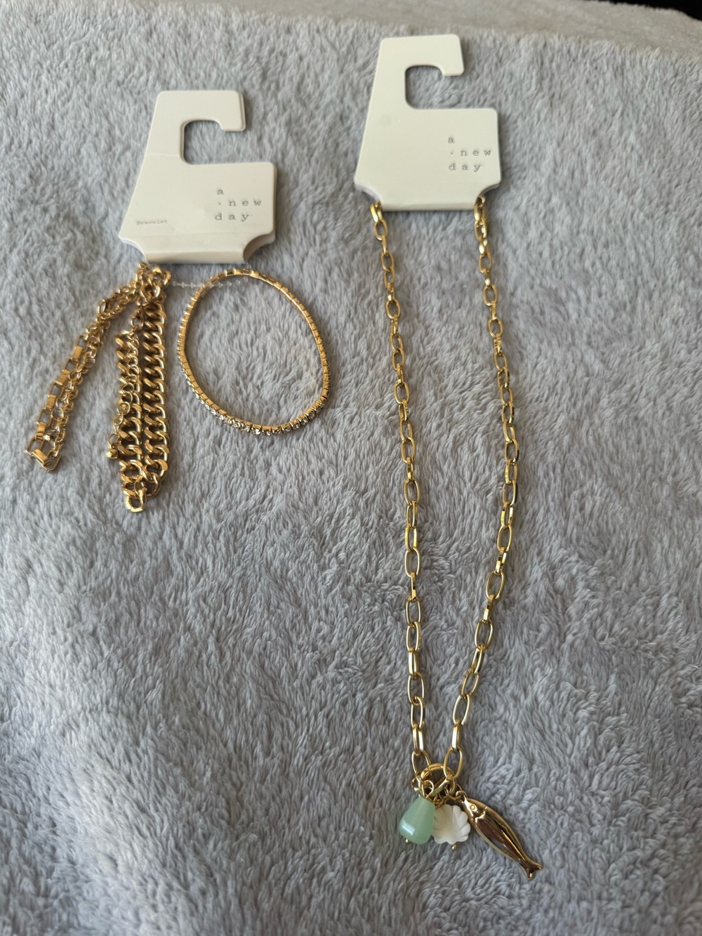 A New Day Gold Toned Ocean Themed Necklace and Trio of Bracelets